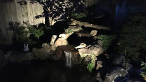 Dramatic landscape lighting on a waterfall